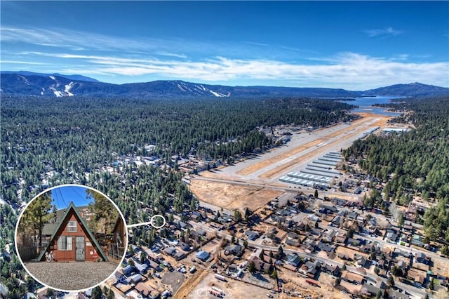 birds eye view of property with a mountain view