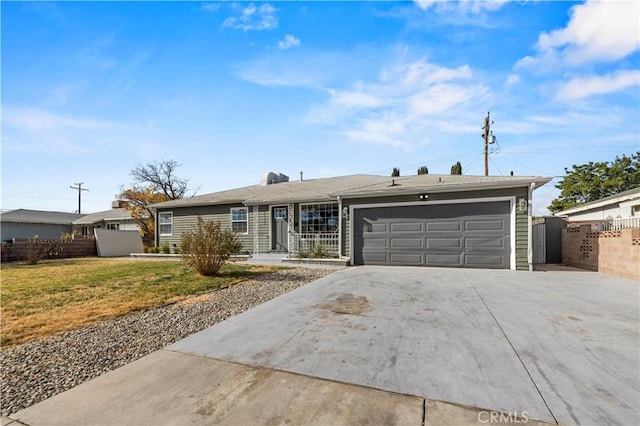 ranch-style house featuring a front yard and a garage