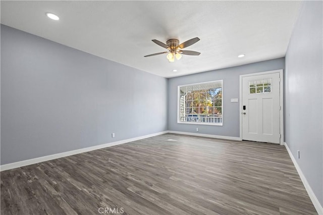 interior space featuring ceiling fan and dark wood-type flooring