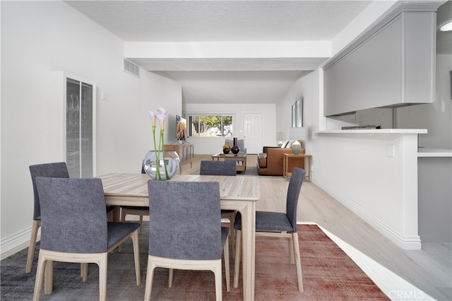 dining area featuring light hardwood / wood-style flooring