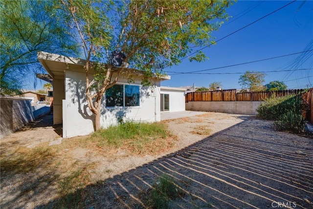 back of property featuring a patio area