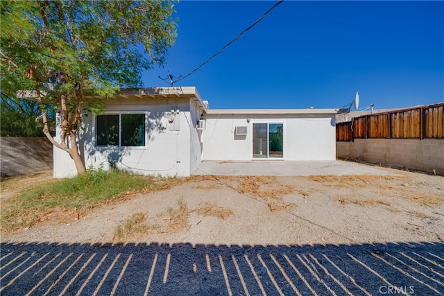 back of property with a patio area