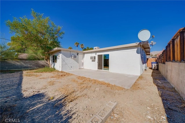 back of property with a patio area