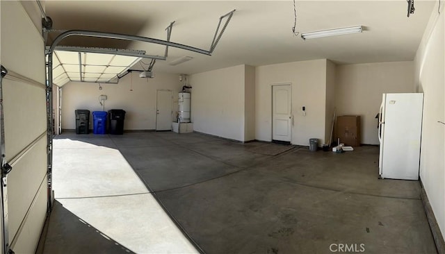 garage with secured water heater, white fridge, and a garage door opener