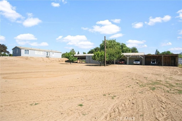 view of yard with a carport