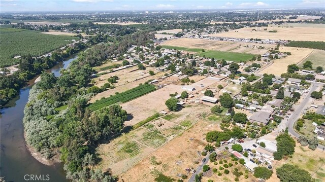 drone / aerial view featuring a water view and a rural view