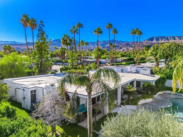 birds eye view of property with a mountain view