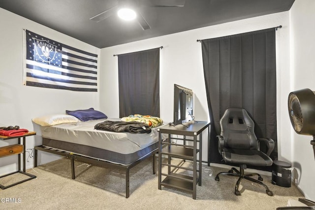 bedroom featuring ceiling fan and light carpet