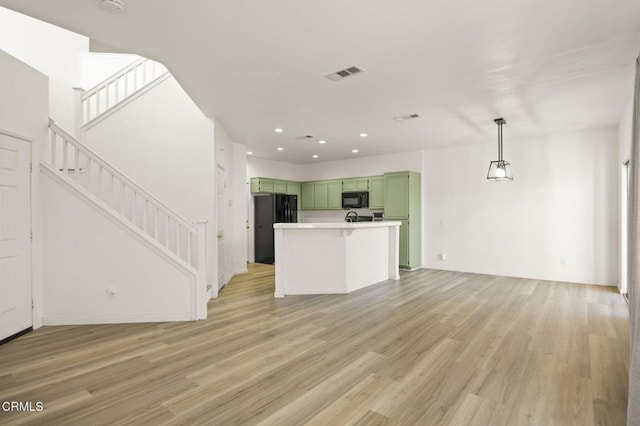 unfurnished living room featuring light hardwood / wood-style floors