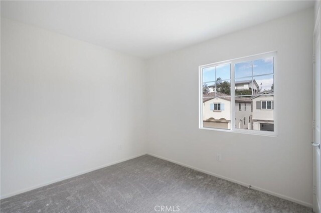 empty room with carpet flooring