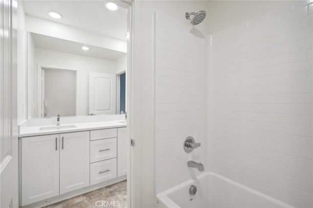 bathroom with bathing tub / shower combination and vanity