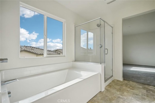 bathroom featuring plus walk in shower