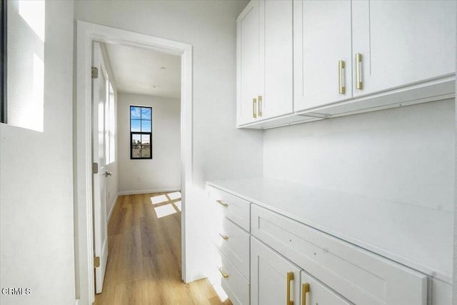 hallway with light wood-type flooring