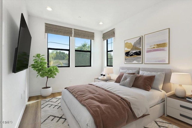 bedroom with light hardwood / wood-style flooring