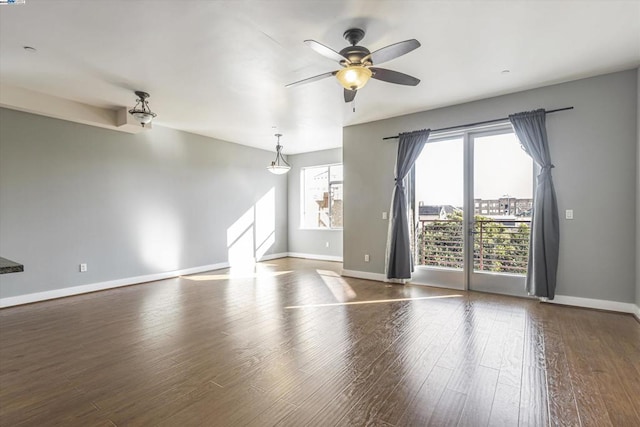 spare room featuring ceiling fan and wood-type flooring