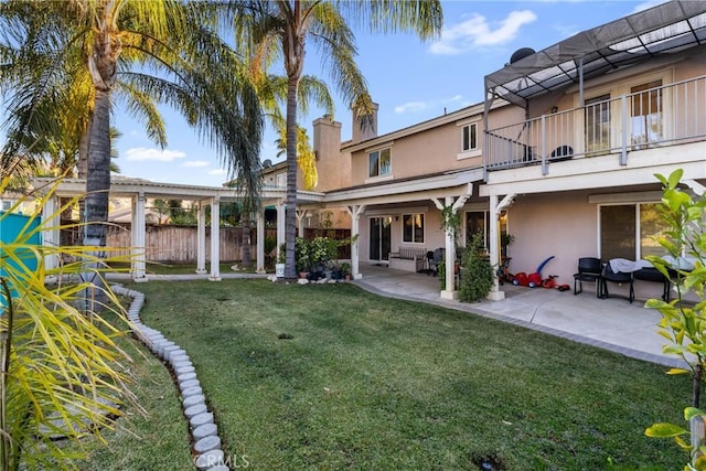 view of yard with a patio area and a balcony