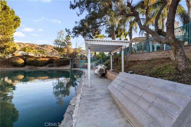 view of pool featuring a pergola and a mountain view