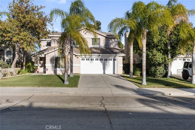 view of front of property with a front yard and a garage