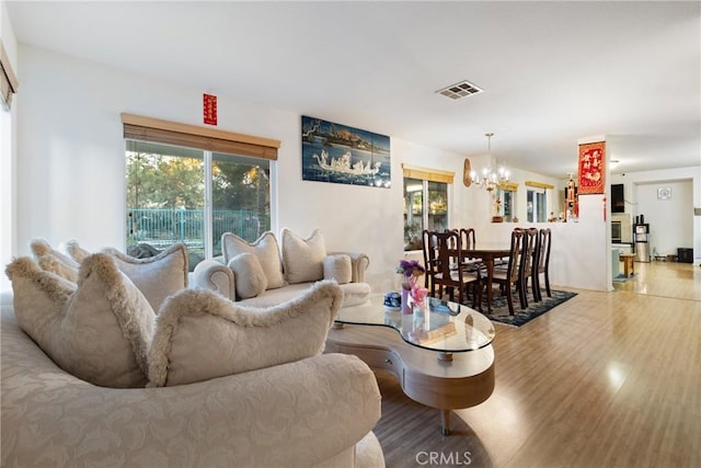 living room featuring a chandelier and hardwood / wood-style flooring