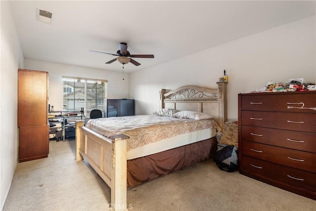 bedroom featuring ceiling fan and light carpet