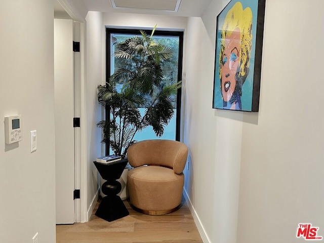 sitting room featuring hardwood / wood-style flooring