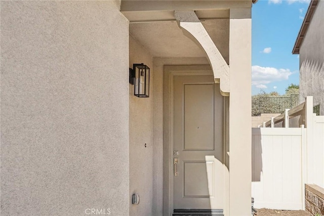34260 Summer Ln, Yucaipa, CA 92399 - property entrance featuring stucco siding and fence