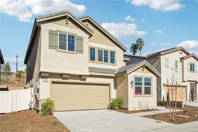 34260 Summer Ln, Yucaipa, CA 92399 - view of front of house with a garage, fence, concrete driveway, stucco siding, and a tiled roof