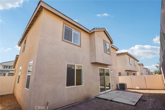 34260 Summer Ln, Yucaipa, CA 92399 - back of property with fence, a patio, central AC, and stucco siding