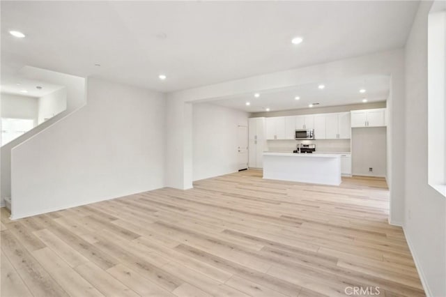 34260 Summer Ln, Yucaipa, CA 92399 - unfurnished living room featuring recessed lighting and light wood-type flooring