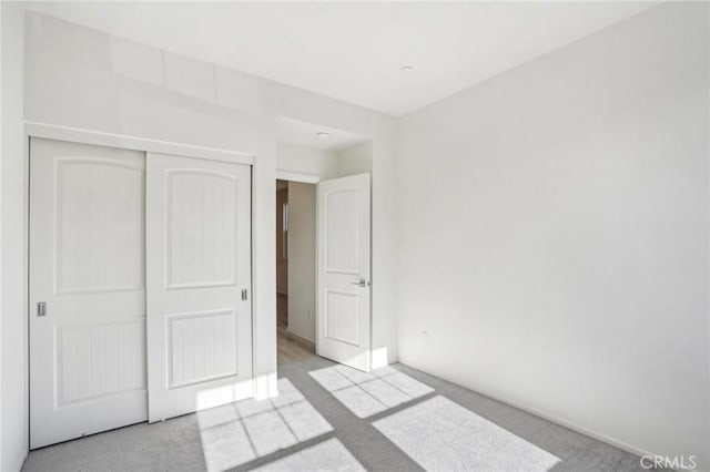 34260 Summer Ln, Yucaipa, CA 92399 - unfurnished bedroom featuring carpet flooring, a closet, and baseboards