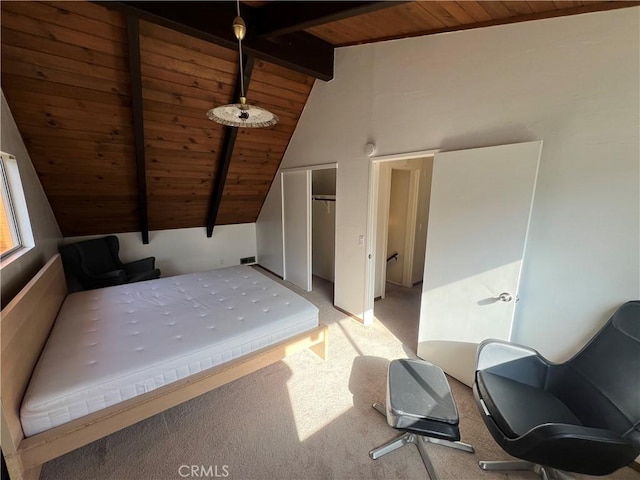 bedroom with vaulted ceiling with beams, wood ceiling, and light colored carpet