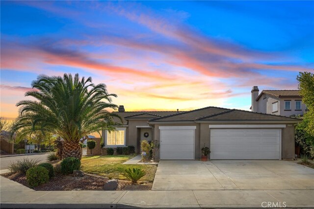 view of front of property with a garage