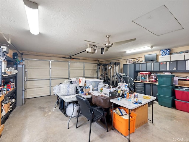 garage with stainless steel refrigerator and a garage door opener