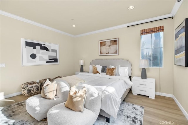 bedroom with crown molding and light wood-type flooring