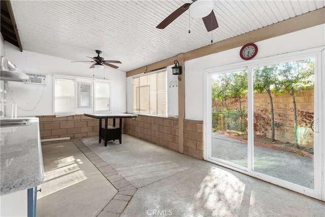 sunroom / solarium with ceiling fan