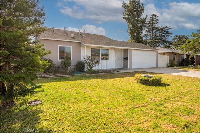 ranch-style home with a garage and a front yard