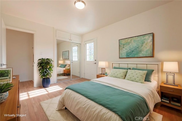 bedroom with light hardwood / wood-style floors