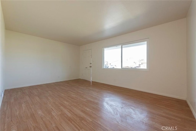 unfurnished room featuring light hardwood / wood-style floors