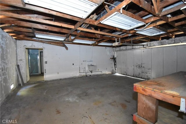 garage with a garage door opener and sink