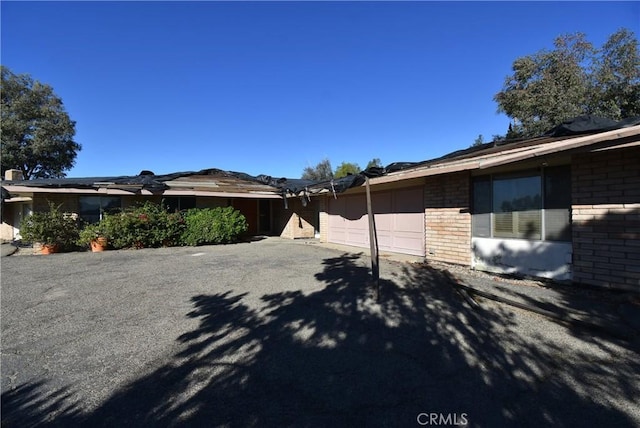 view of side of home with a garage