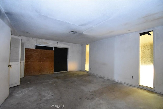 spare room featuring concrete floors