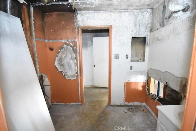 bathroom with concrete flooring