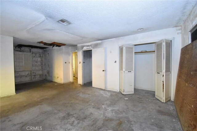 basement with a textured ceiling