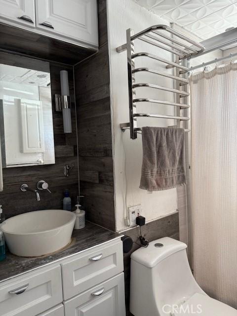 bathroom with toilet and vanity