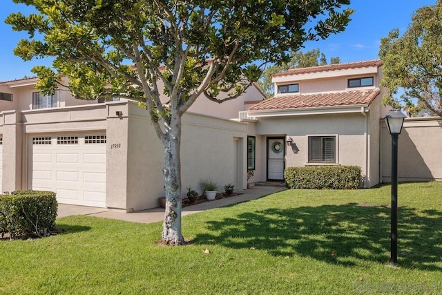 mediterranean / spanish-style house featuring a front lawn