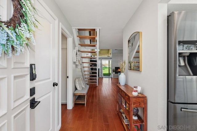 corridor featuring dark hardwood / wood-style flooring