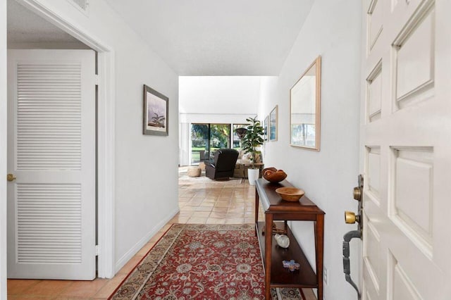 hallway with light tile patterned floors