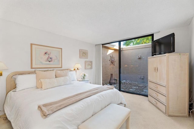 carpeted bedroom with access to outside and floor to ceiling windows