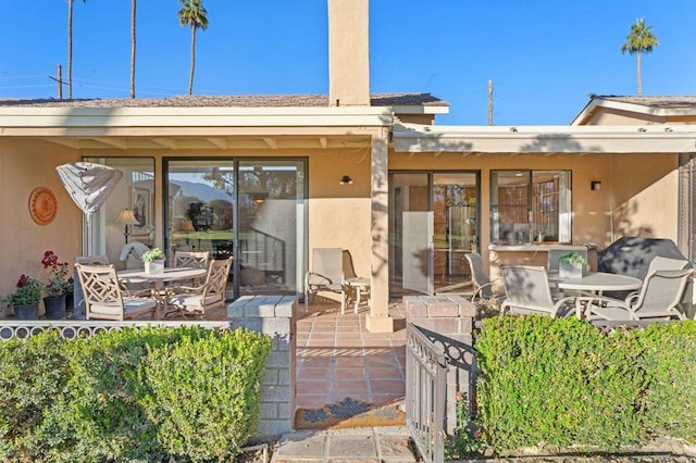 rear view of property with a patio