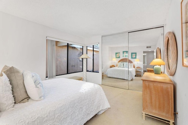 bedroom with a closet and carpet floors